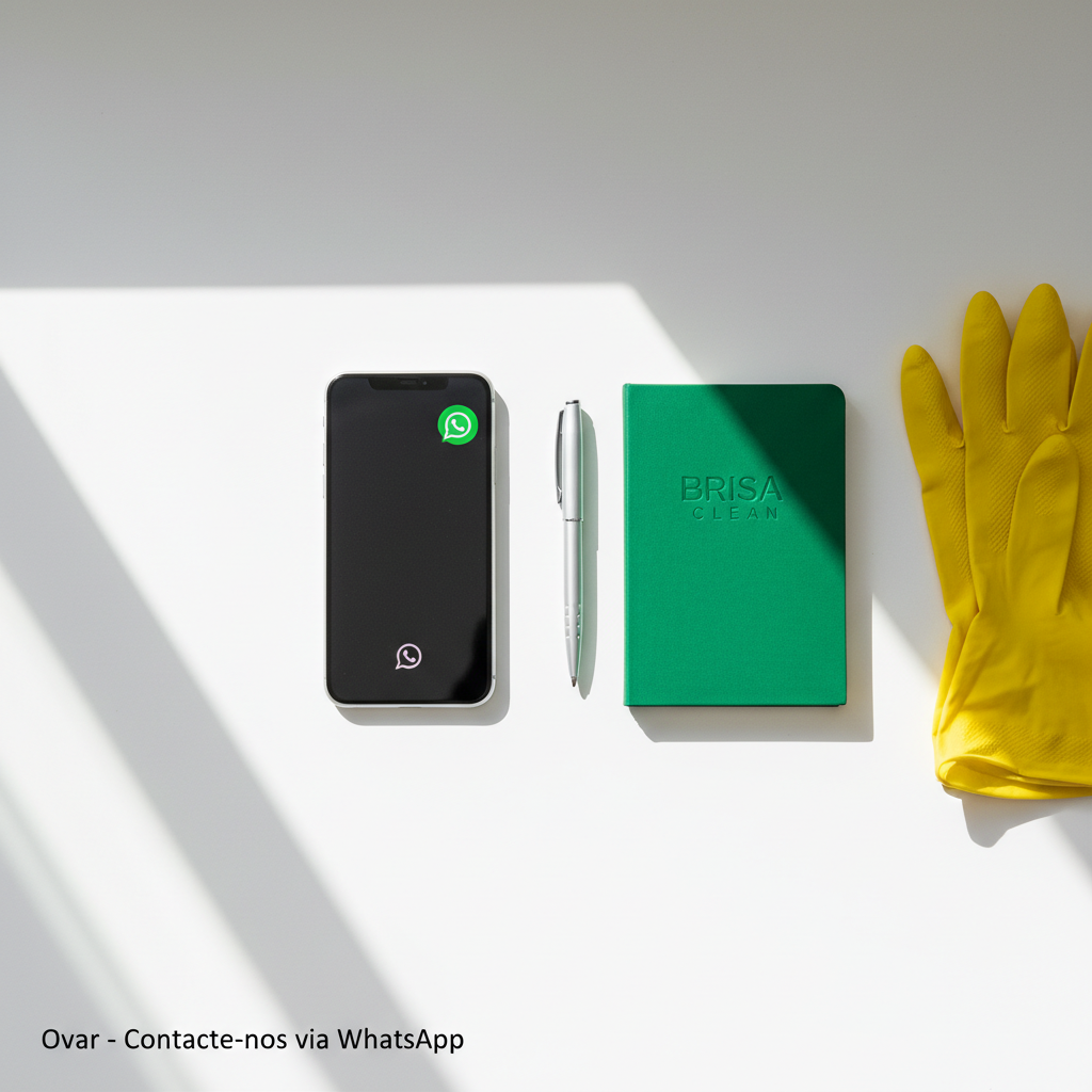 A clean, well-lit service information scene on a neutral white desk, featuring a modern smartphone lying flat with a bright green chat bubble icon visible on its screen, suggesting an incoming WhatsApp message without showing any actual text. Beside it, a small green notebook, a pen, and a pair of spotless rubber cleaning gloves rest neatly folded. Soft, diffused daylight from a nearby window creates gentle reflections on the phone’s glass and subtle shadows around the objects. Photographic realism, top-down composition with balanced negative space, calm and organized atmosphere, visually reinforcing how easily clients in Ovar can contact Brisa Clean via WhatsApp for their professional cleaning needs.